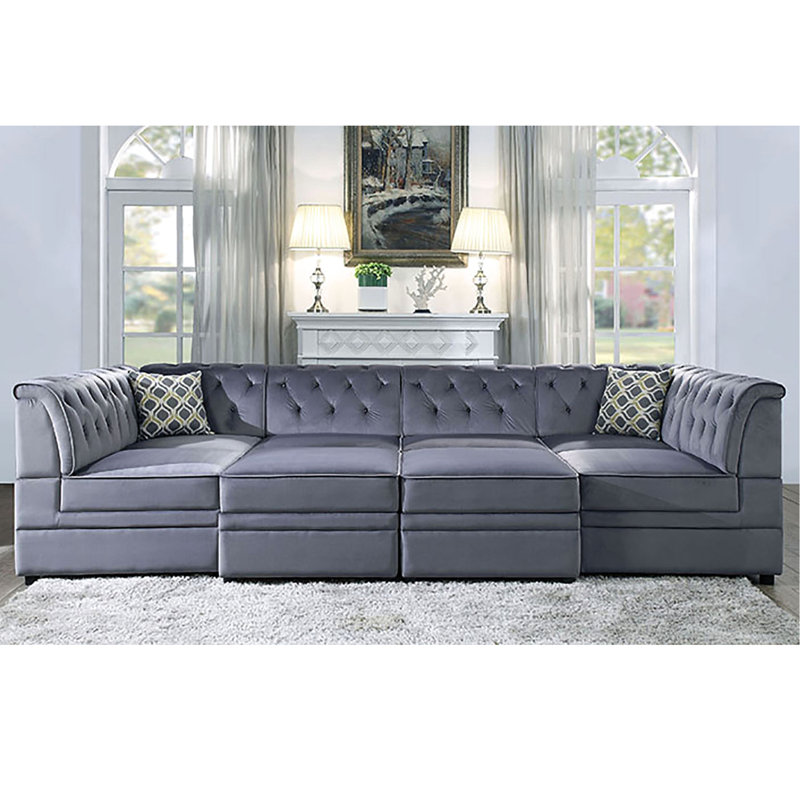 Fauteuil chic en velours gris sans accoudoirs avec motif de boutons