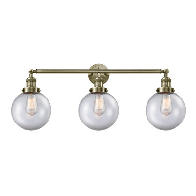 Éclairage pour meuble-lavabo en laiton antique à 3 lumières Lorri