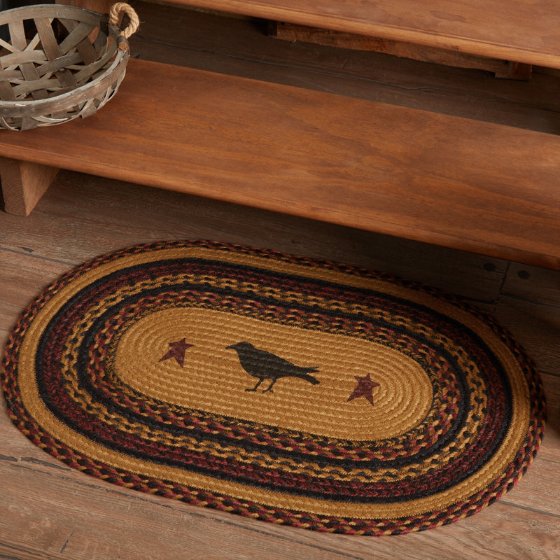 Oval Braided Jute Rug with Crow Design in Black and Mustard