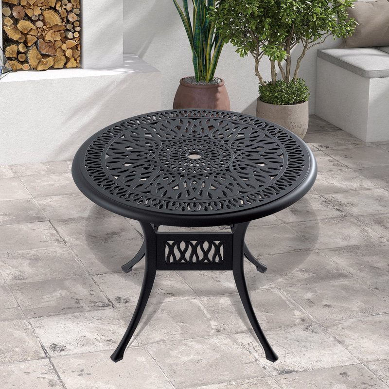 Table de salle à manger en fonte d'aluminium avec cadre noir et trou pour parasol