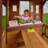 Backyard Discovery Spruce Hollow Spruce Wood Swing Set with Wave Slide, Clubhouse, Rock Wall, and Play Kitchen