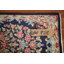Tapis bleu carré à motif floral 2 x 2