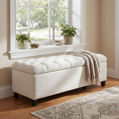 Banc repose-pieds avec rangement, surface bouclée, pieds en bois d'hévéa