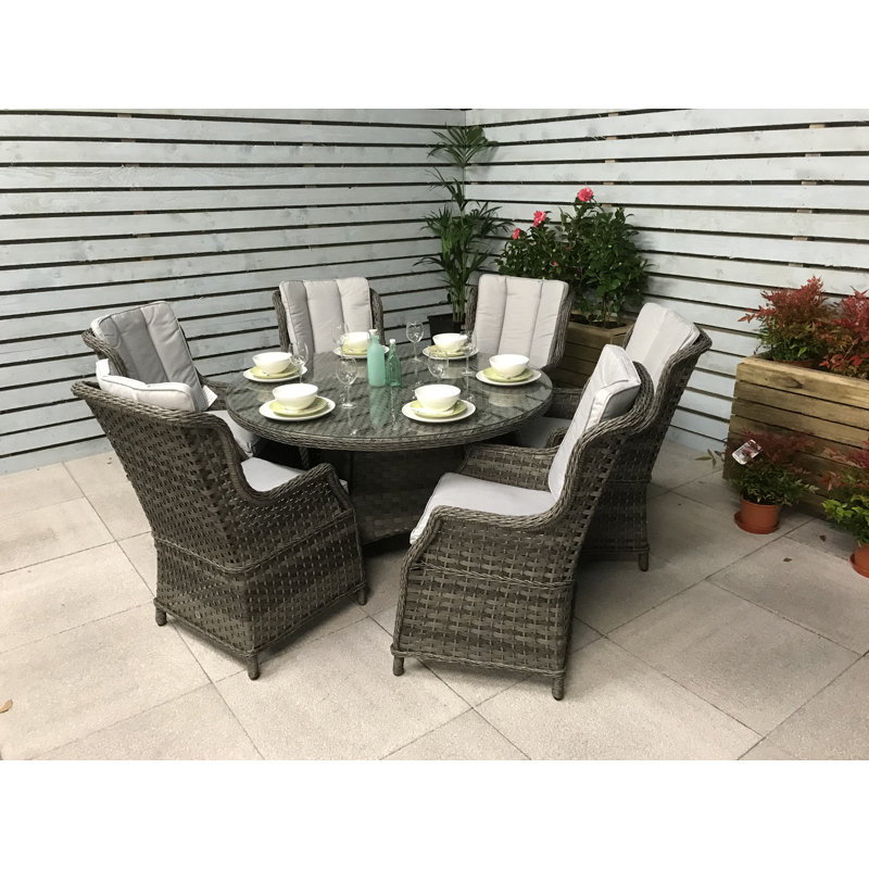 Southwell 6 - Person Wicker Patio Dining Set with Round Table , Cushions Included