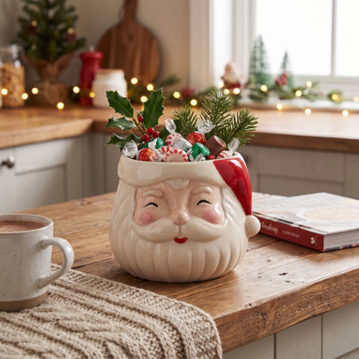 Pot de fleurs en forme de père Noël en grès