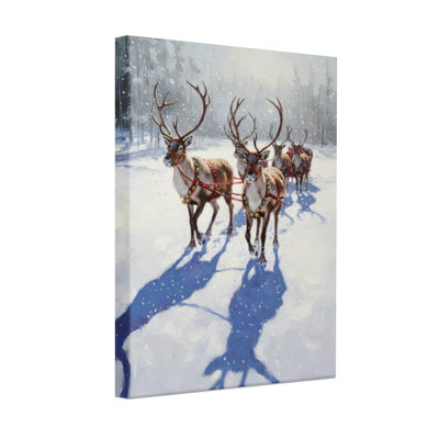 Renne de Noël tirant un traîneau dans une forêt enneigée, ensemble de 3 impressions sur toile