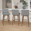 Tabouret pivotant à hauteur réglable en bois et rembourré Dorreen-2124057863-2124057862