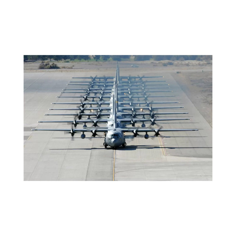 A Line Of C-130 Hercules Taxi At Nellis Air Force Base, Nevada by Stocktrek Images - Wrapped Canvas Print