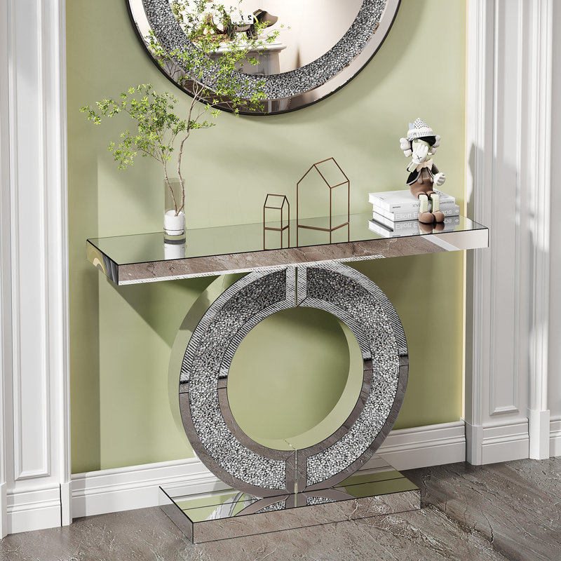 Console en O avec miroir et cristal, derrière le canapé