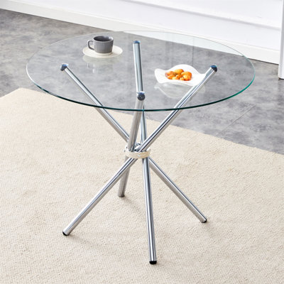 Table de salle à manger ronde en verre transparent avec une forme unique pour 4 à 6 personnes, avec des pieds en métal argenté en forme d'anneau, convenant aux bureaux, aux cuisines, aux terrasses et aux salles à manger.