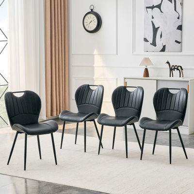 Ensemble de 4 chaises de salle à manger en polyuréthane noir avec poignée intégrée. Cadre en métal noir, pieds réglables. Chaises de salle à manger à domicile avec coussin confortable extra-large, polyvalent pour de multiples cas de figure.