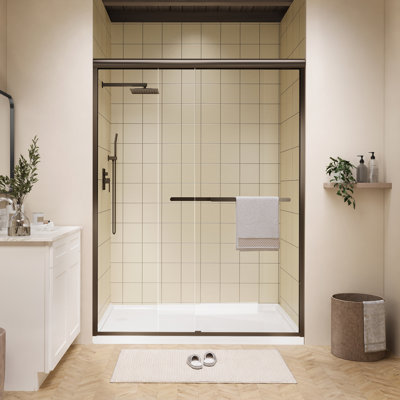 Porte de douche coulissante double encadrée de 50 à 54 po x H 72 po en bronze huilé avec poignées doubles et verre transparent