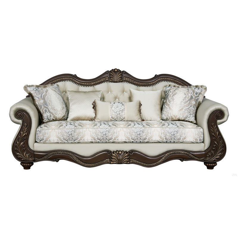 Canapé en tissu beige et finition cerise avec 5 coussins