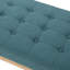 Élégant banc bleu sarcelle, revêtu d'un tissu de qualité et d'une structure texturée en bois de bouleau