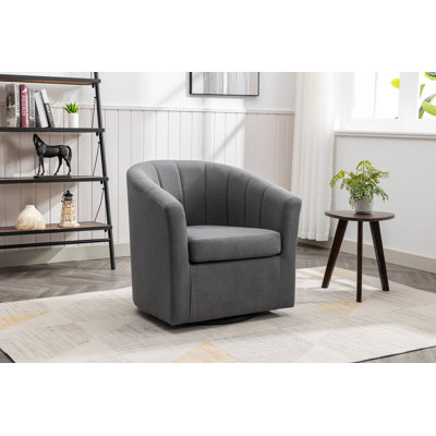 Fauteuil demi-tonneau pivotant en tissu Arleyne