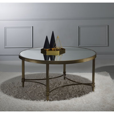 Table basse, finition miroir et laiton antique