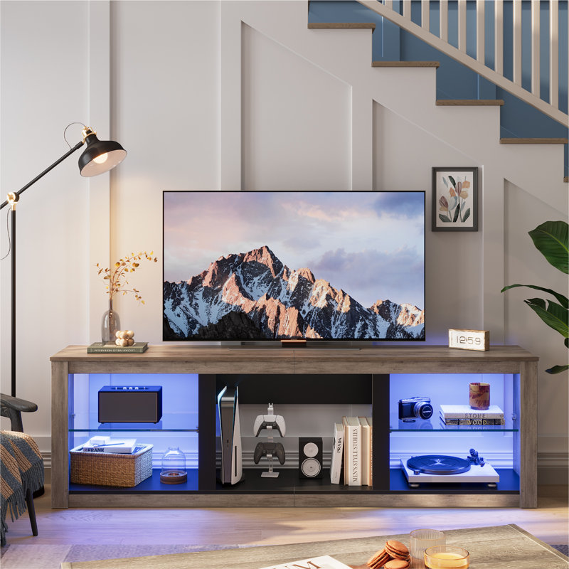 Kruszewski 70 In. TV Stand Fits TVs Up To 75 In. with LED Lights Glass Shelves and Open Storage, Grey Wash