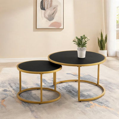 Ensemble de 2 tables basses gigognes rondes en similicuir noir profond avec base en acier doré pour le salon