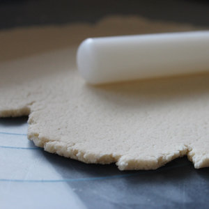 A thickly rolled-out salt dough on a counter
