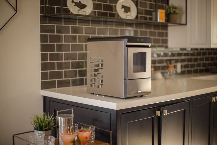 stainless steel portable ice maker on a kitchen counter