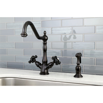 Kingston Brass Duchess Two-Handle 2-or-4 Hole Deck Mount Kitchen Faucet with Brass Sprayer