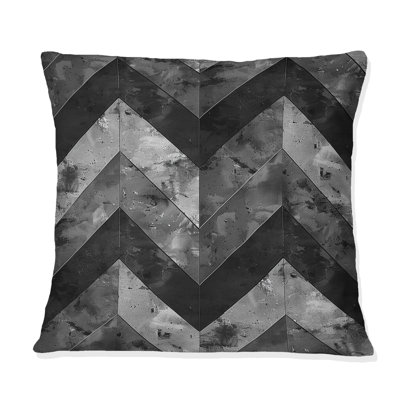 Coussin décoratif noir à motif de chevrons noirs et gris