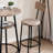 A Light Gray And Black Three-Piece Rounded Bar Table And Chair Set, With A Round Table And Two Bar Stools, Suitable For Breakfast Areas, Minibars And Small Office Spaces.