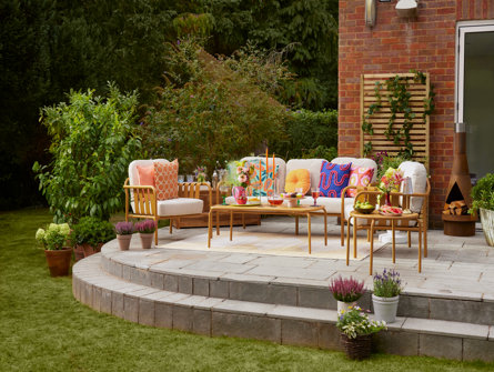 Garden patio seating area with outdoor furniture.