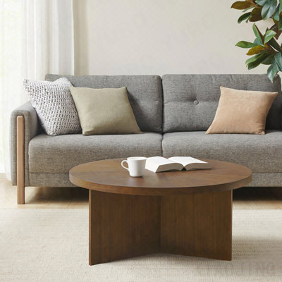 1 table basse ronde ci-dessous