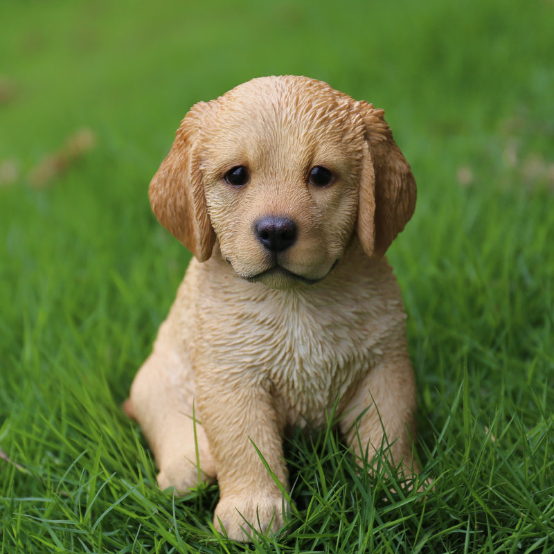 Statue retriever chiot assis