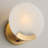 7" H x 7.25" W 1-Light Sconce in Aged Brass with Natural Alabaster Stone