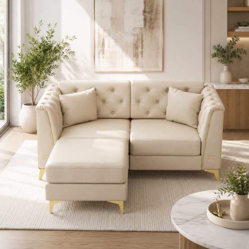 Canapé modulaire en similicuir Riner avec capitonnage à boutons et garniture en métal Riner, Beige White