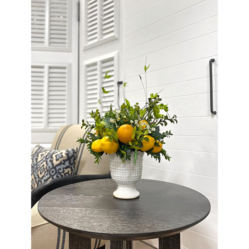 Lemon And Boxwood Arrangement In A Ceramic Pot