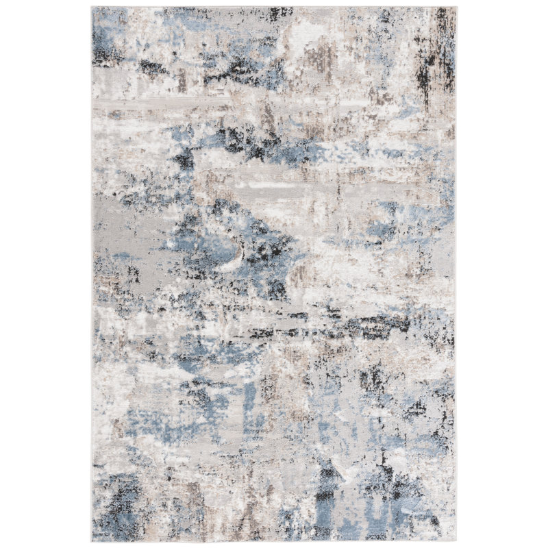 Ivory and Blue Abstract 8' x 10' Synthetic Area Rug