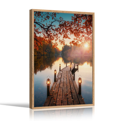 Tableau sur toile représentant un quai en bois avec des lanternes au coucher du soleil d'automne