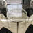 Quantis Round Glass Top Metal Base Dining Table