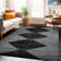 Tapis noir à rayures géométriques ivoire