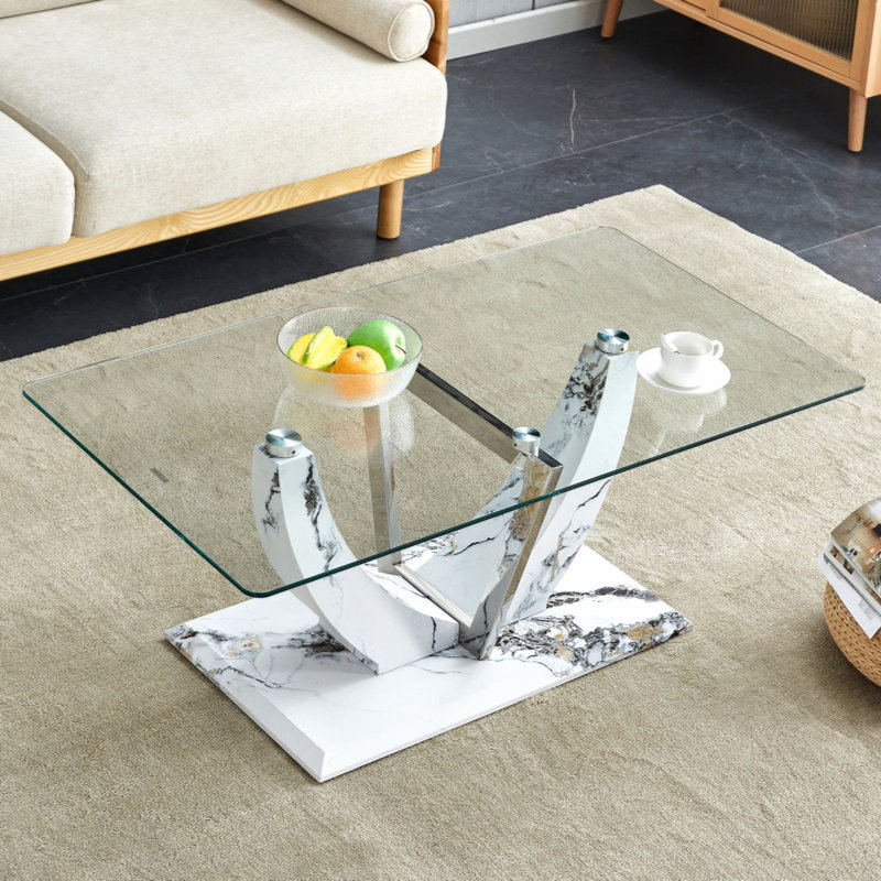 Table basse moderne en verre avec pieds en bois aggloméré et colonnes décoratives en acier inoxydable., Blanc/Noir, Clair