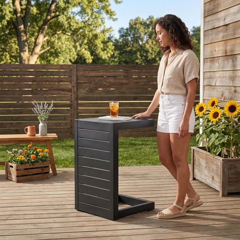 C-shaped end table from the Cape Coral Alu collection, finished in black., Black