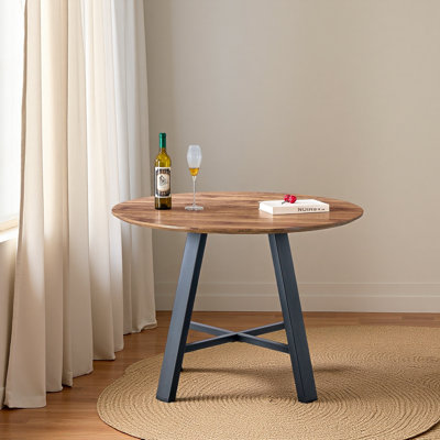 Une table de salle à manger circulaire en bois moderne et minimaliste. Bureau en bois aggloméré de 42 pouces de diamètre, pieds en métal, convenant à la maison et au bureau F-1172