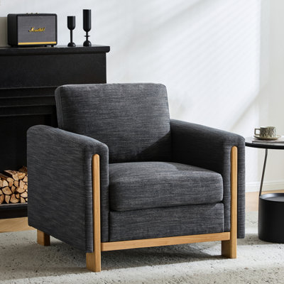 Fauteuil élégant avec revêtement en tissu, structure apparente en bois d'hévéa, dossier rembourré, accoudoirs carrés, couleur anthracite, 90 cm de large, 86 cm de profondeur, hauteur idéale pour un intérieur moderne et esthétique.