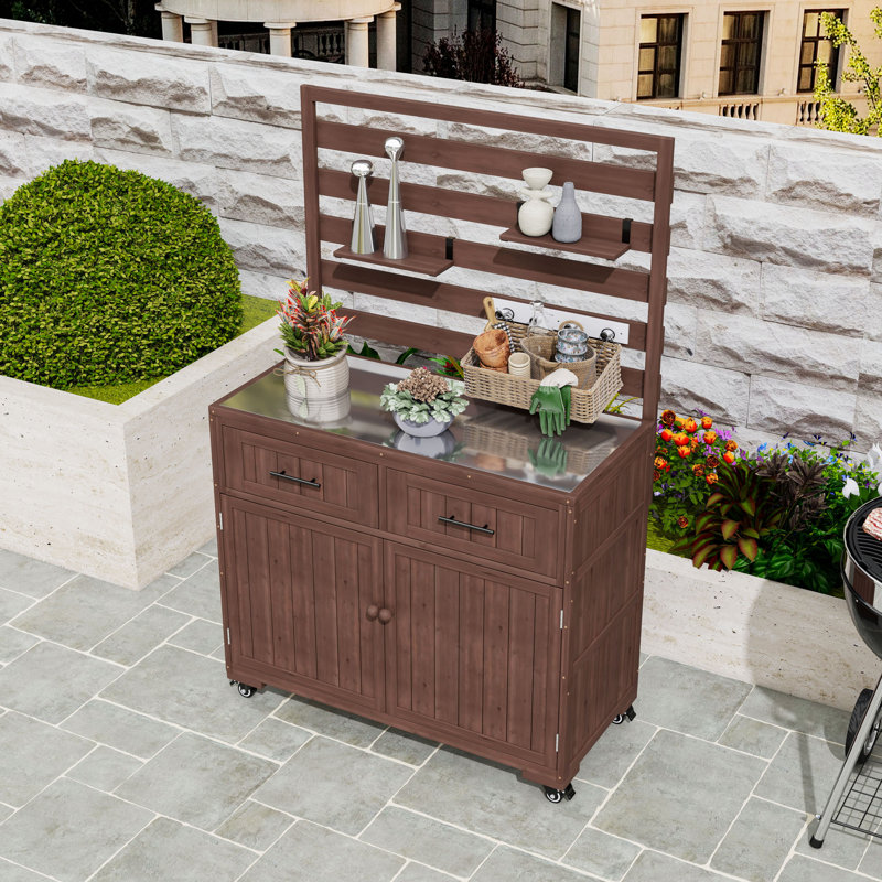 Îlot de cuisine en bois avec plateau, armoire et tiroirs en acier inoxydable