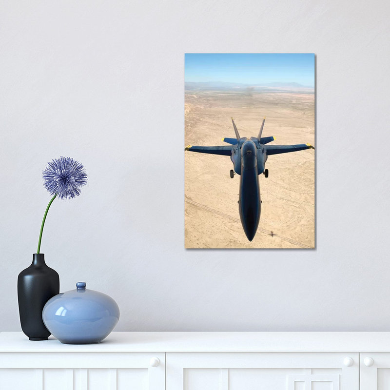 F/A-18A Hornet Flys Over The Desert Landscape Of Imperial Valley by Stocktrek Images - Wrapped Canvas Print