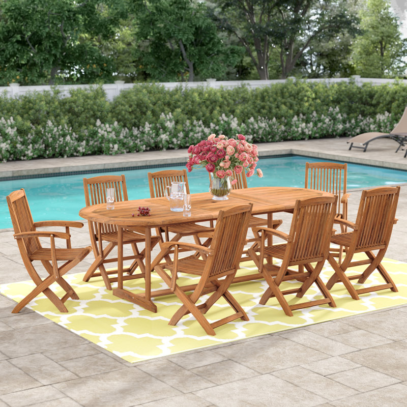 Karsch 8 - Person Acacia Solid Wood Patio Dining Set Umbrella Hole Included Oval Table
