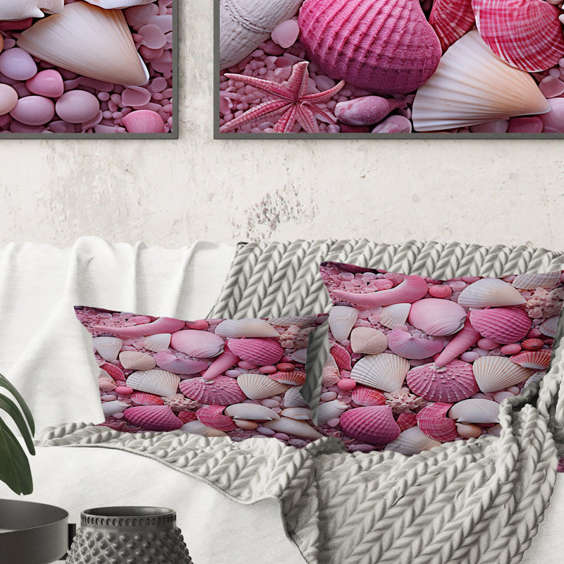 Coussin rose à imprimé coquillage rose sur la plage