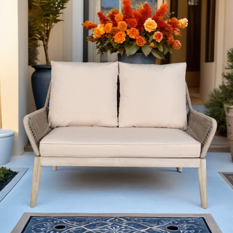 Banc de patio en bois d'acacia avec coussins Beryna