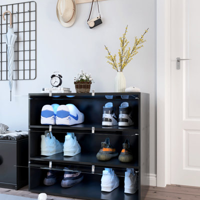 Meuble à chaussures avec porte en verre noir et éclairage DEL, rangez vos chaussures facilement grâce à la porte et à l'éclairage LED. Design artistique.