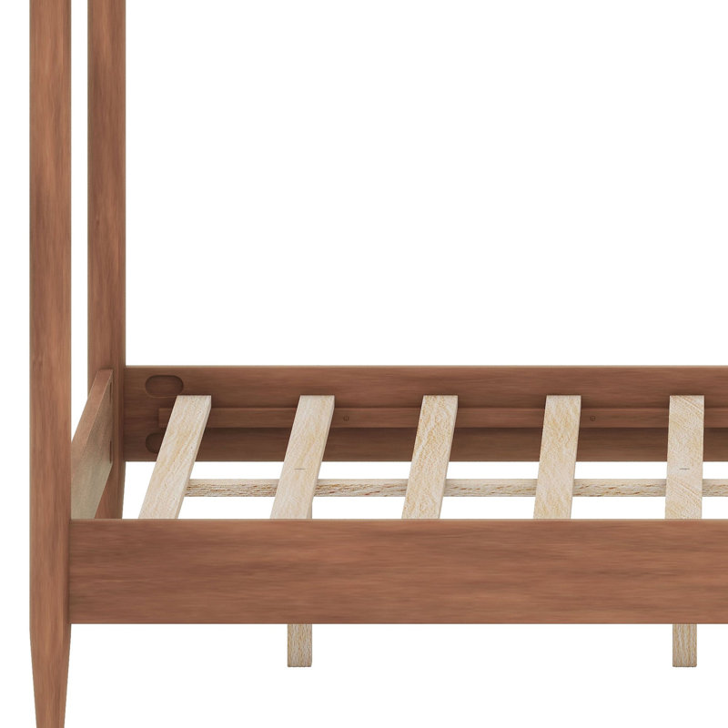 Cadre de lit à baldaquin avec tête de lit moelleuse et design à quatre colonnes fuselées pour un style moderne du milieu du siècle