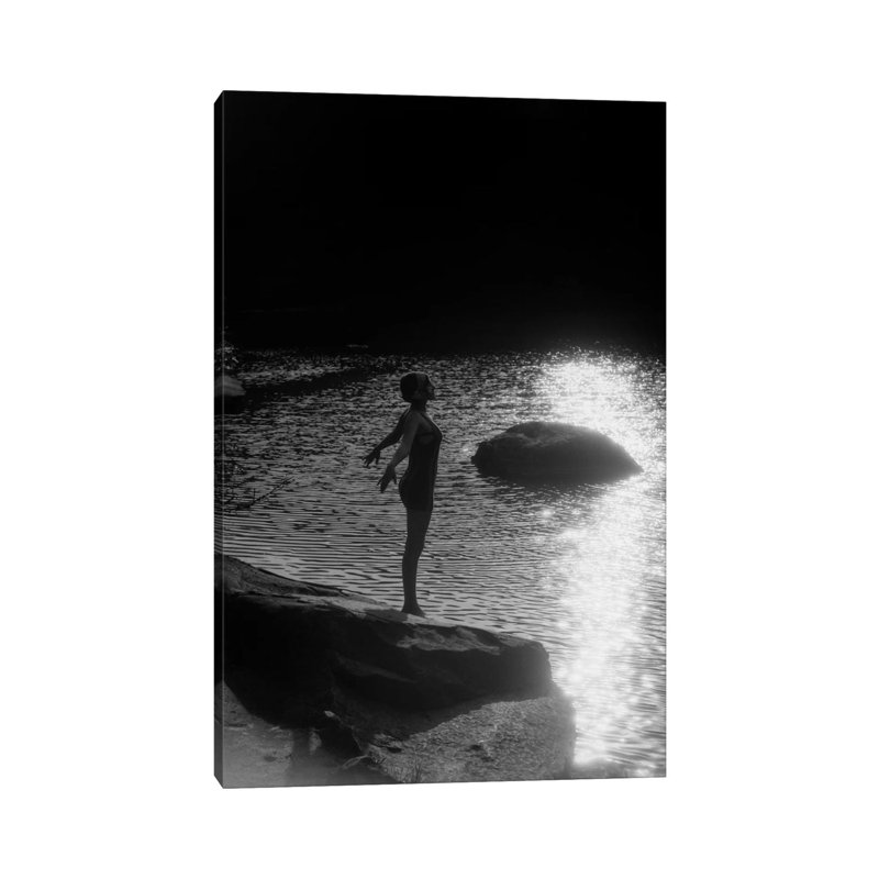 1920s Sunset Silhouette Of Anonymous Woman Standing On A Rock Near Water About To Dive In by Vintage Images - Wrapped Canvas Print