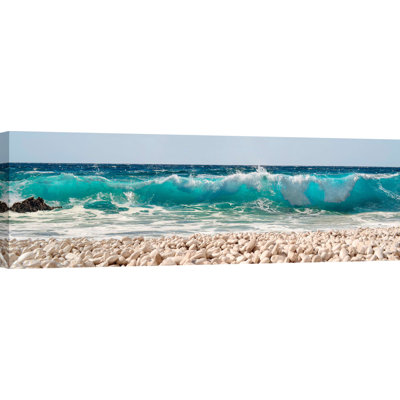Wave On Pebbles Beach von Pangea Images - Drucken